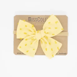 Diadema bebé lazo amarillo plumeti