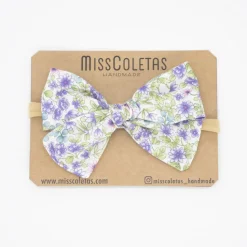 Diadema bebé lazo flores malva