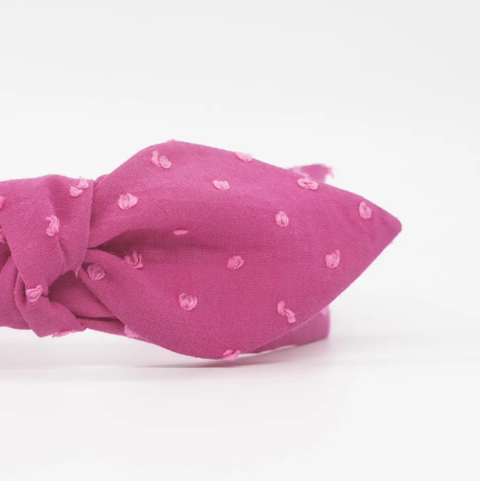 Diadema lazo chloé fucsia plumeti hecha a mano