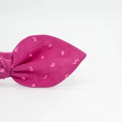Diadema lazo fucsia plumeti hecha a mano