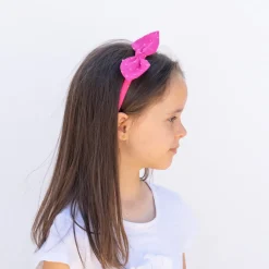 Diadema lazo fucsia plumeti hecha a mano