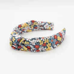 Diadema nudo flores azul marino hecha a mano