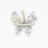 Pinza mariposa flores malva