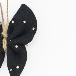 Pinza mariposa negra topos oro
